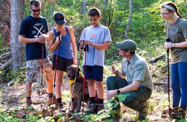 group of people with park ranger