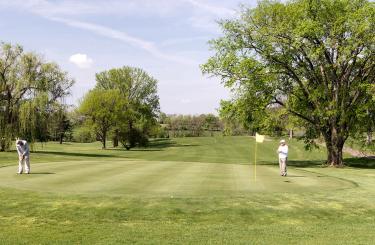 Lincoln Homestead Golf course greens with golfers