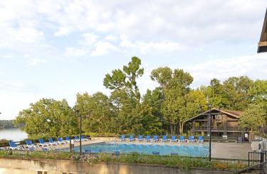 TImber archetecture of lodge overlooking the pool and lake